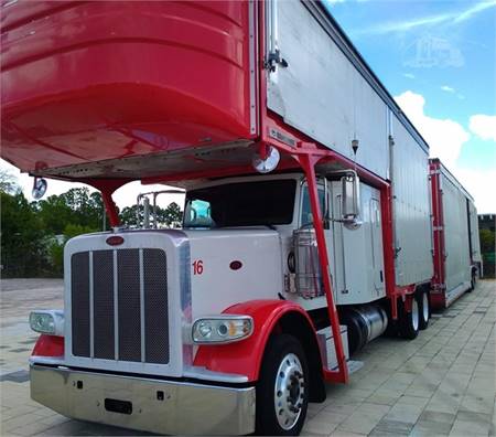 Red Peterbilt semi with enclosed trailer
