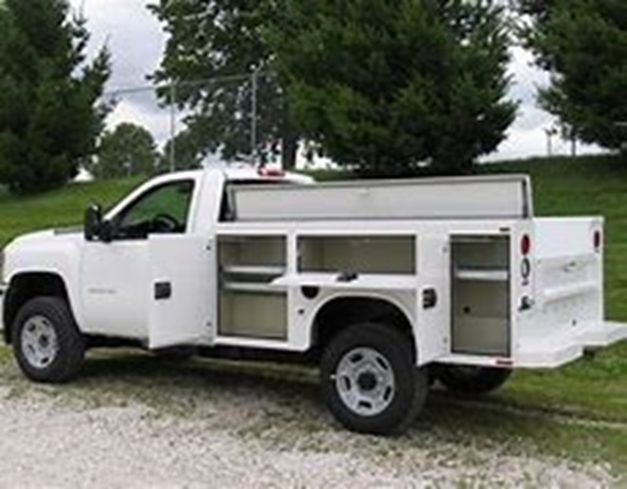 White utility truck with crane body, side view